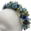 Stunning hand beaded multi-tonal blue crown with gold hardware detail.